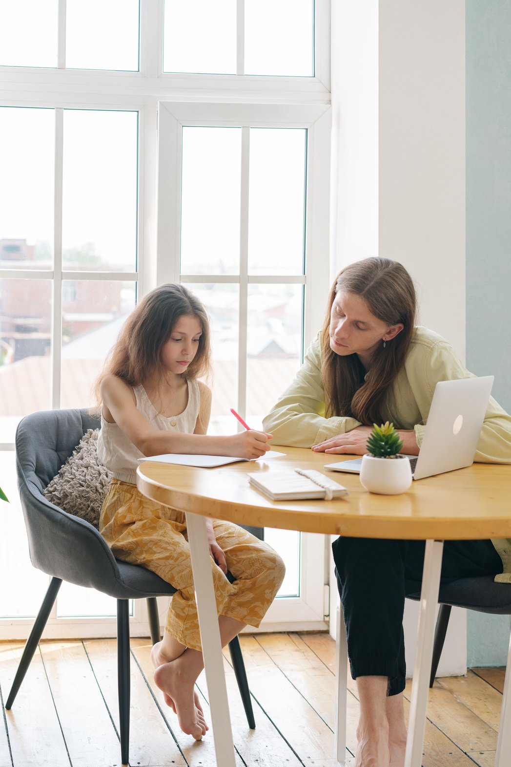 A Father Tutoring His Daughter